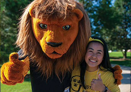 Mascot giving thumbs up with student. Links to Donor-Advised Funds Mascot giving thumbs up with student. Links to Donor-Advised Funds